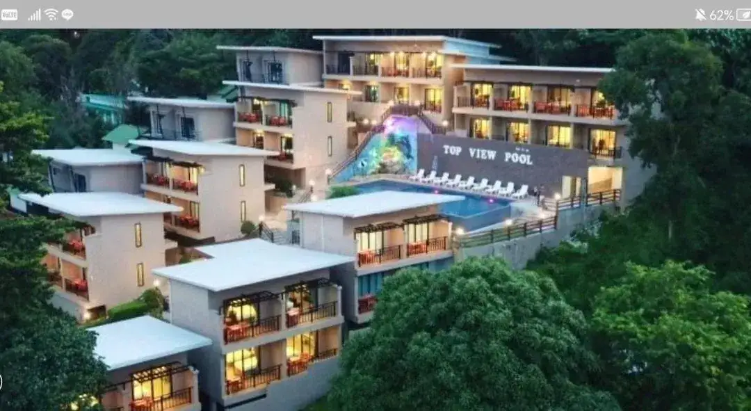 Aerial view of Phi Phi Top View Resort with its pools and warm evening lights in Koh Phi Phi
